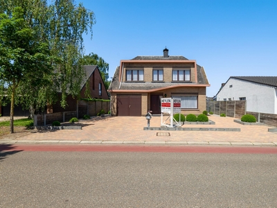 Vrijstaande woning met 4 slaapkamers, garage en tuin