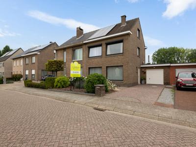 Ruime halfopen woning met zonnige tuin en garage!