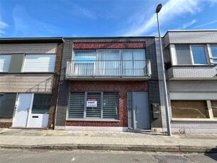 Gelijkvloers appartement met private tuin en garagebox inbeg