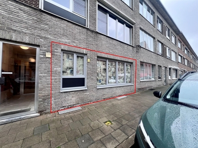 Gelijkvloers appartement met 2 slaapkamers, tuin en garagebox