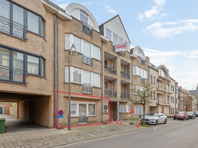 Gelijkvloers appartement met 2 slaapkamers, tuin en garage