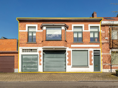 Woning met 2 à 3 slpks, garage en groot magazijn