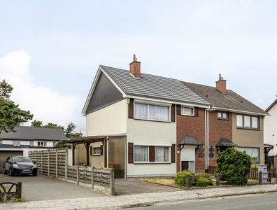 Zeer goed onderhouden woning met veranda en garage