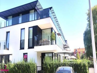 Nieuwbouwappartement met garage in een groene zone